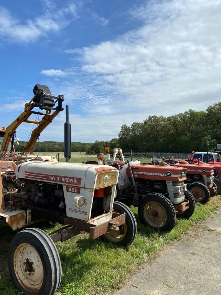 Tractors in Row in Green Countryside