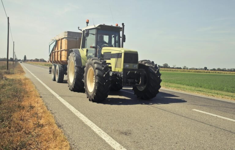 Yellow Tractor in Asphalt Road